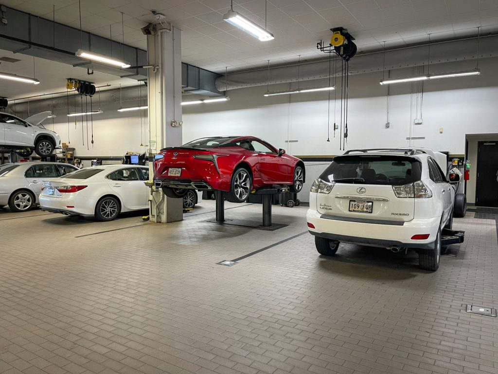 a garage filled with lots of different types of cars